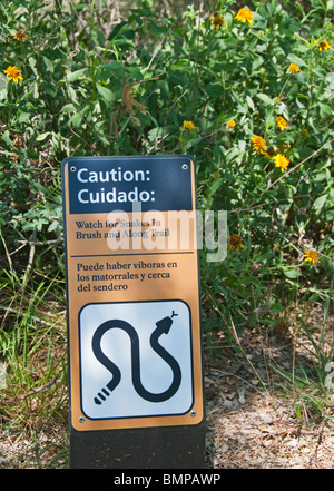 Texas, Brownsville, Palo Alto Battlefield National Historic Park bilingual english spanish snake warning sign Stock Photo