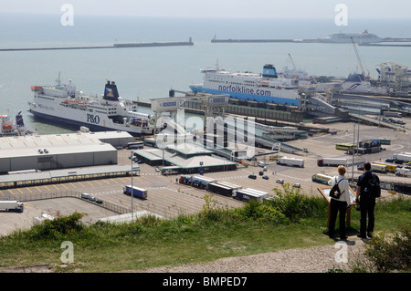 Tourists on coastal path above the cross channel port of Dover Kent England In docked ferries P&O Seafrance & Norfolkline ships Stock Photo