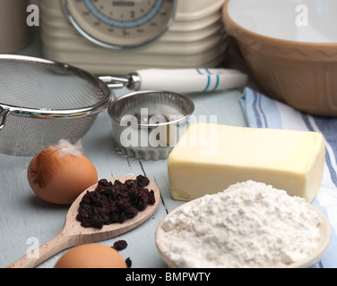 Baking Ingredients Laid Out On A Wooden Kitchen Table Stock Photo