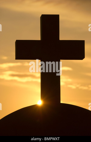 Silhouette of a Greek Orthodox cross on a church top against the ...