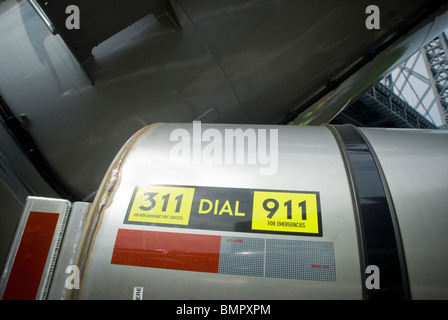 Advertising promoting the 311 information line and the 911 emergency line Stock Photo
