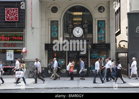 People Walk On E 42nd Street Passed Nat Sherman S Tobacconist To The World In Midtown Manhattan Stock Photo Alamy