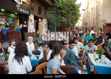 Street scene Cairo; People congregating in the restaurants and cafes of the Islamic quarter, Cairo, Egypt Africa Stock Photo