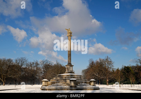 Phoenix Park monument Dublin Ireland Avenue path walkway trail tree snow snowfall winter christmas scene scenic Stock Photo