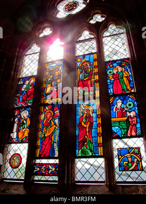 Thirteenth-Century Medieval stained-glass windows at The Cloisters Museum in New York City depict biblical scenes. Stock Photo