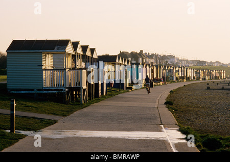 Sun setting on beach huts in Whitstable, Kent, UK Stock Photo