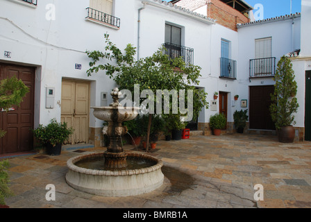 Fountain in town square, whitewashed village (pueblo blanco), Yunquera, Malaga Province, Andalucia, Spain, Western Europe. Stock Photo