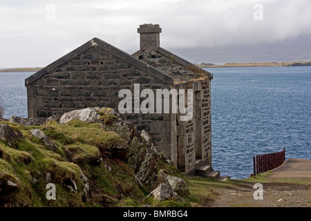 The old pier and building at Aird on the Craignish Peninsula Argyll Scotland Stock Photo