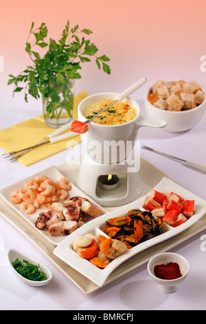 Seafood fondue. Step by step: PGGJEK-PGGJF1-PGGJF5-PGGJFC Stock Photo