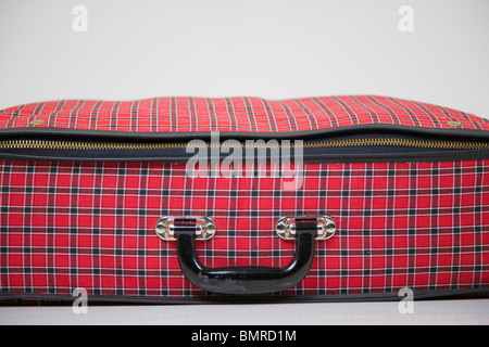 Red checked pattern suitcase on white background Stock Photo