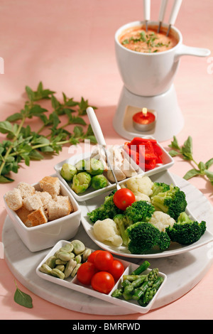 Cheese fondue with vegetables and oregano. Step by step: PGGJGF-PGGJGH-PGGJGM-PGGJGP Stock Photo