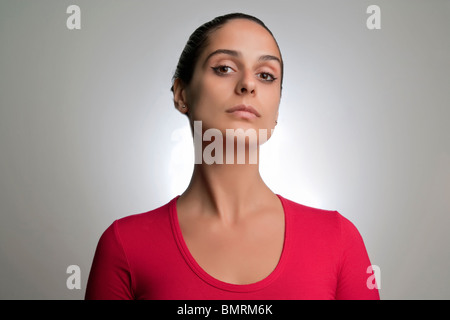 Woman looking down at the camera Stock Photo