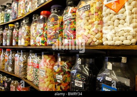 Jars of sweets on shelves at a traditional sweet shop in the Uk Stock ...