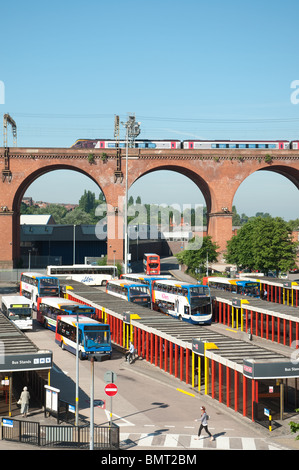 Virgin train travel across Stockport viaduct with Stockport Bus Station below. Stock Photo