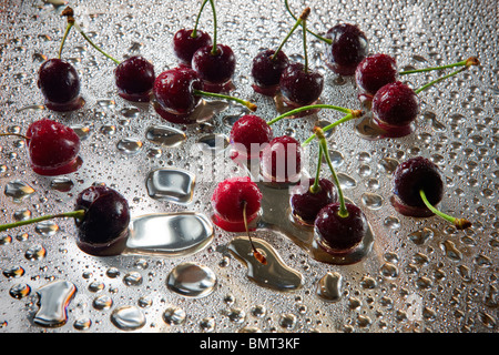 Wet sweet cherry with water droplets. Stock Photo