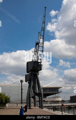 A crane at Royal Victoria Dock in London with the Excel Exhibition Centre in the background. Stock Photo