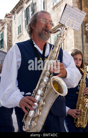 Man with Saxophone in street brass band, Dubrovnik, Dalmatia, Croatia Stock Photo