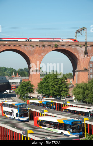 Virgin train travel across Stockport viaduct with Stockport Bus Station below. Stock Photo