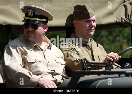 Military officers riding in a jeep Stock Photo