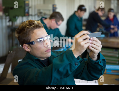 An apprentice checking a part, Muelheim an der Ruhr, Germany Stock Photo