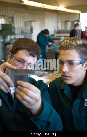 Apprentices checking a part, Muelheim an der Ruhr, Germany Stock Photo