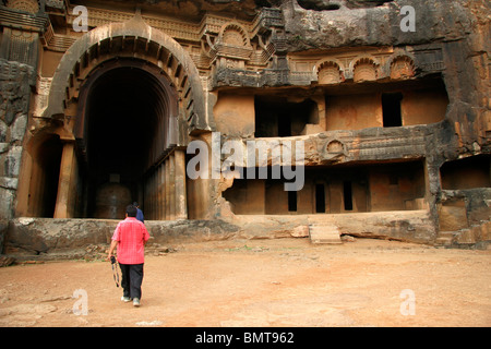 Tourist at Indian heritage place called Bhaja caves entering  Chitya hall ; Lonavala ; Maharashtra ;  India Stock Photo