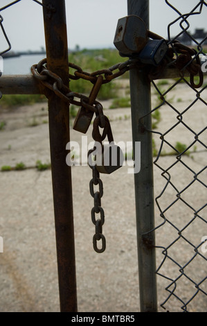 Gate locked with padlocks and chain in the Red Hook neighborhood in the borough of Brooklyn in New York Stock Photo