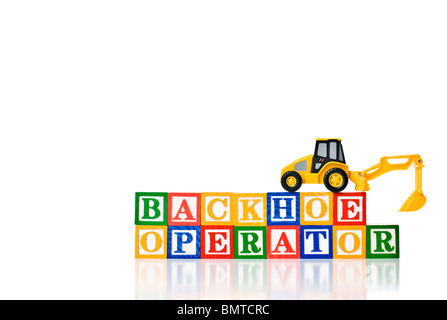 Colorful children's blocks spelling BACKHOE OPERATOR with a model backhoe Stock Photo