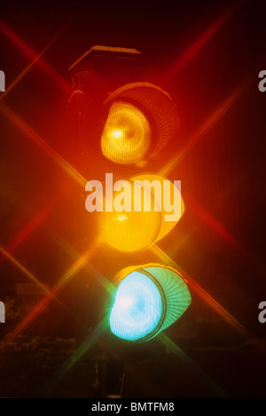 time exposure of traffic light showing red amber and green lights at night Leeds Yorkshire UK Stock Photo
