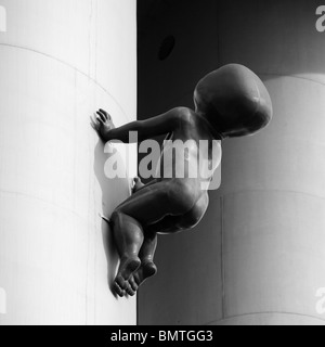 Giant crawling baby sculpture by David Cerny on Zizkov television Tower Prague Czech Republic eastern Europe Stock Photo