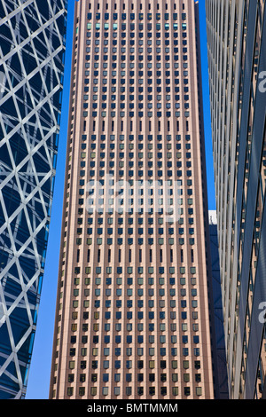 Cocoon Tower, Shinjuku Center Building, and Shinjuku L Tower stretch into the clear blue sky of the western Nishi-Shinjuku district in Tokyo, Japan. Stock Photo