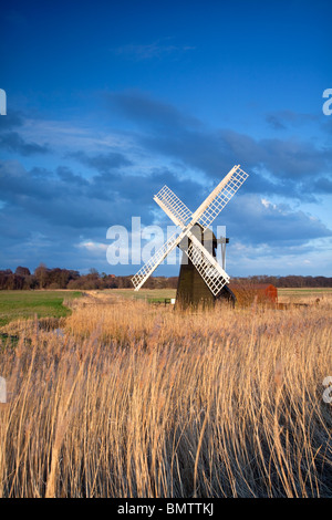 Herringfleet drainage mill illuminated at last light in Suffolk Stock Photo