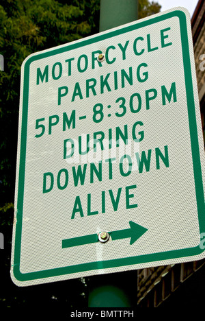 Sign showing restricted motorcycle parking hours during Downtown Live festivities in Lafayette LA Stock Photo