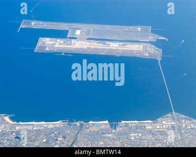 The artificial islands of Kansai International Airport (KIX) seen from 10´000 meters altitude (Aerial), Osaka JP Stock Photo