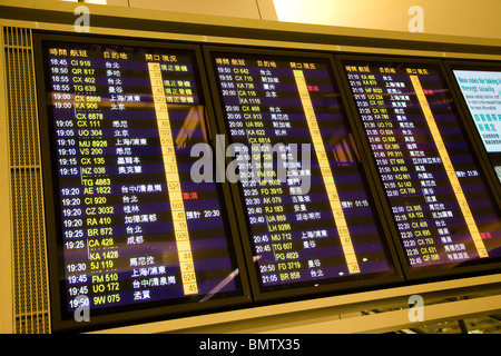 Departures board departure board sign chek lap kok Stock Photo