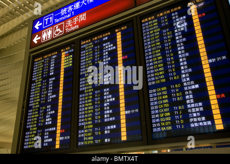 Departures board departure board sign chek lap kok Stock Photo