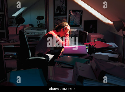 exhausted pretty female working Stock Photo