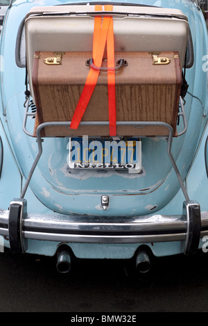 Luggage on rack attached to 1960's automobile Stock Photo
