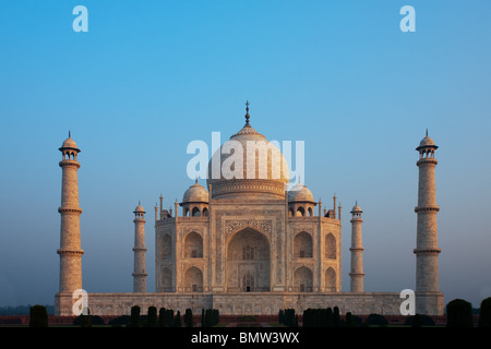 A beautiful daybreak as the iconic Taj Mahal absorbs the morning sunrise colors. Stock Photo