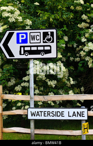 Signs in Waterside Lane Portchester, pointing to car, bus & disabled parking and Public Convenience, also a street name and Fire Hydrant sign, Portchester, Hampshire, UK Stock Photo