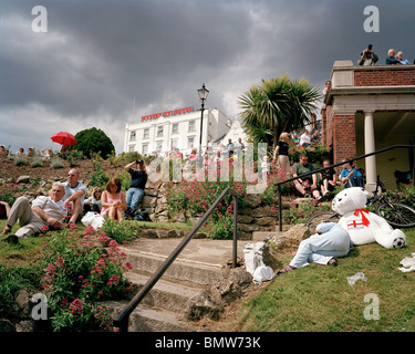 Members of the public watch the 'Red Arrows', Britain's Royal Air Force aerobatic team at Southend Air show. Stock Photo