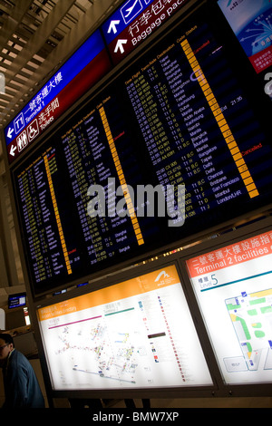 Departures board departure board sign chek lap kok Stock Photo
