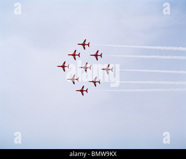 Nine Hawk jets from the elite 'Red Arrows', Britain's prestigious Royal Air Force aerobatic team. Stock Photo