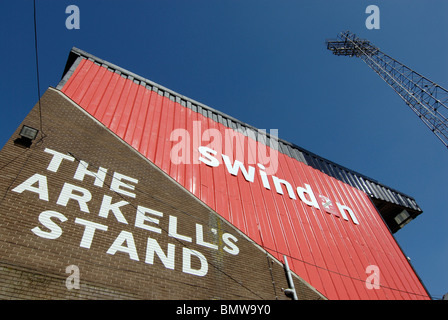 The Arkells stand at the Swindon Football Club's 'County Ground' in Wiltshire, UK. The sky is dark blue and the stand is red. Stock Photo