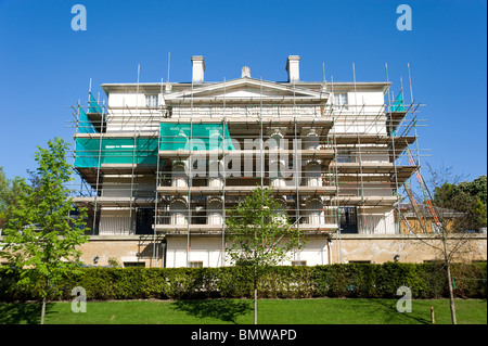 Scaffolding erected around a grand house undergoing renovations, London, England, UK Stock Photo