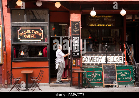 Cafe Employee Readying Place for Opening, Greenwich Village, NYC Stock Photo