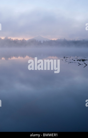 Sunrise Lake Cassidy with fog and Mount Pilchuck with reflections Snohomish County Washington State USA Stock Photo