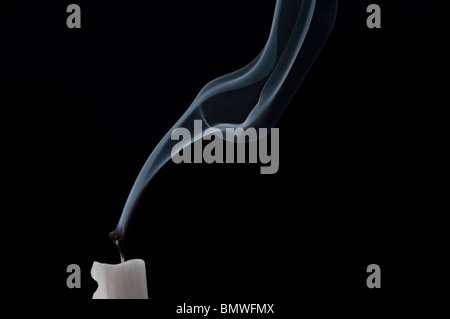 blew out the candle - candle in a draft Stock Photo