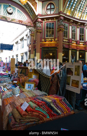 Stall selling textiles and garments at Leadenhall market City of London England UK Europe Stock Photo