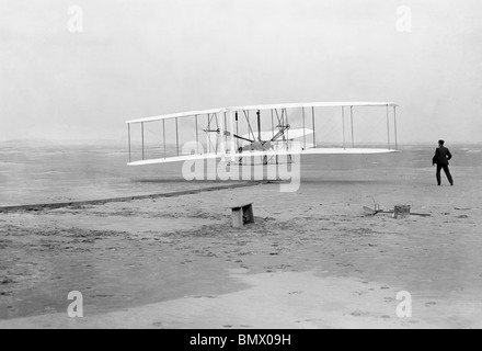 Historic photo of the first ever powered, controlled and sustained heavier than air human flight by the Wright Brothers in 1903. Stock Photo